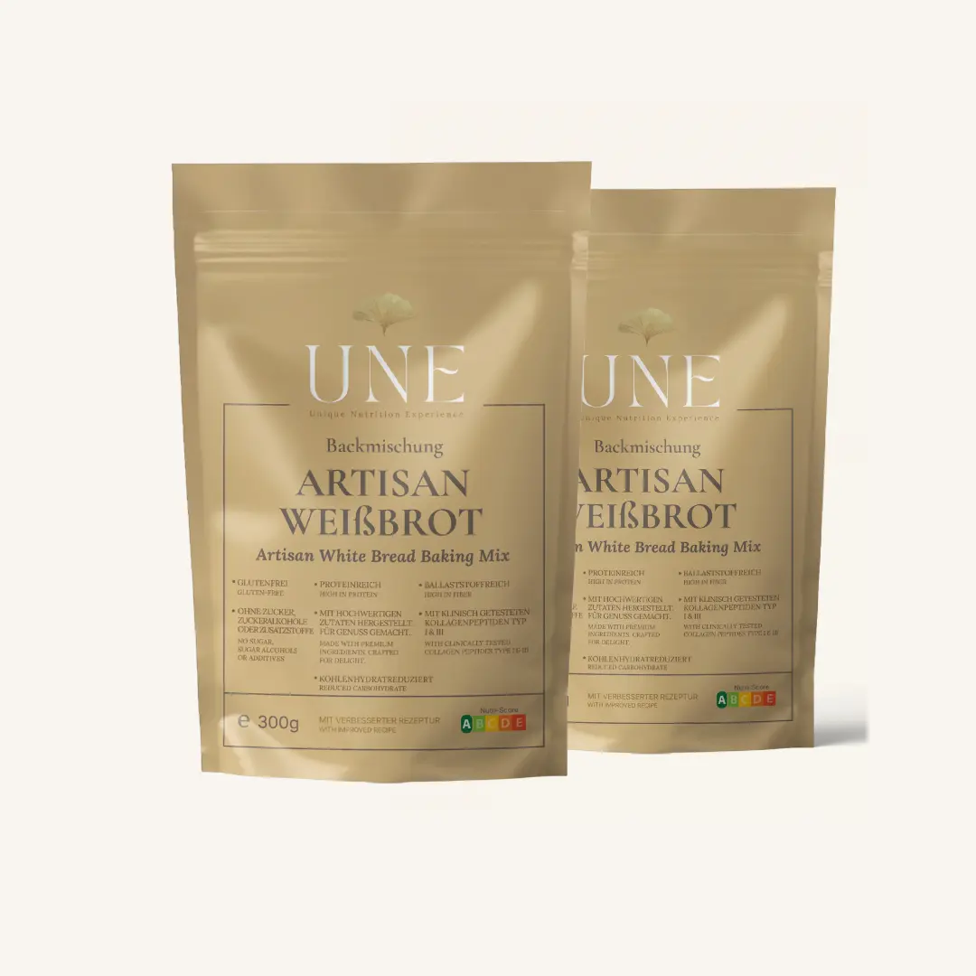 UNE Foods Backmischung Artisan Weißbrot in goldenen 2x 300 g-Standbeuteln mit UNE-Logo und Nutri-Score A